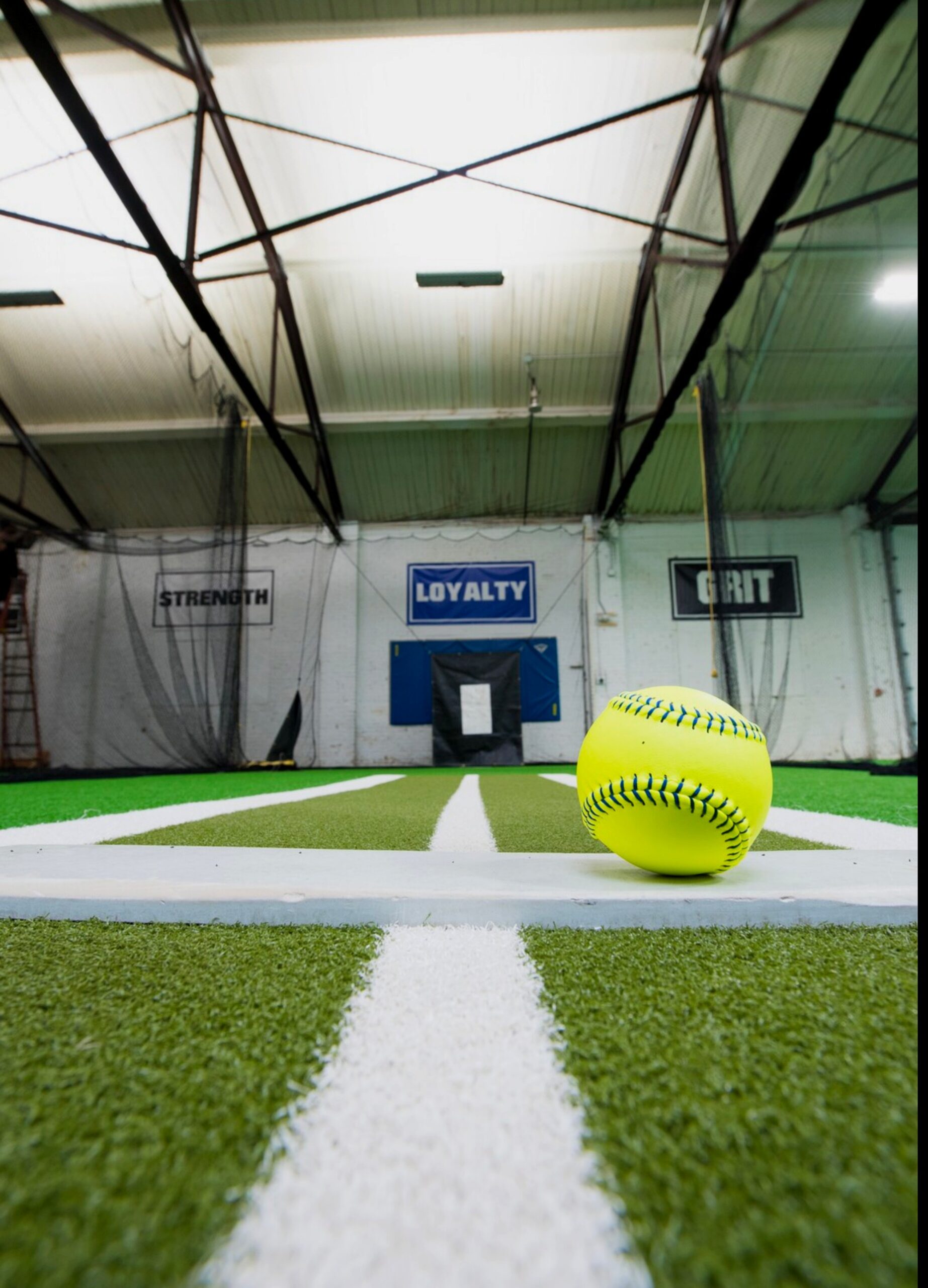 Softball with Diamond Club values — Grit, Loyalty, Strength, Confidence