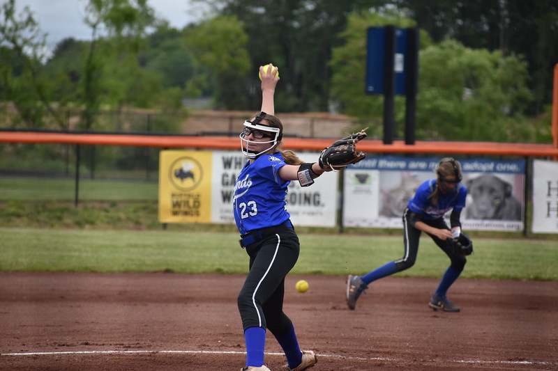 Diamond Softball Club pitcher at full release during a game, demonstrating pitching mechanics