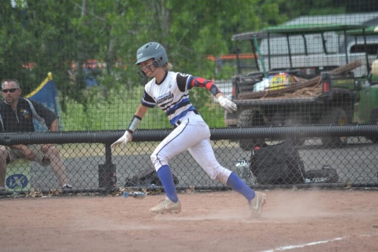Diamond Softball Club player sprinting out of the batters box during a game